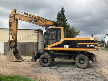 Колёсный экскаватор CATERPILLAR M320