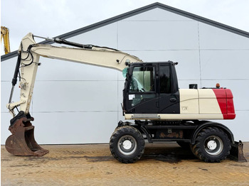 Колёсный экскаватор CATERPILLAR M316D