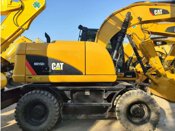 Колёсный экскаватор CATERPILLAR 315D