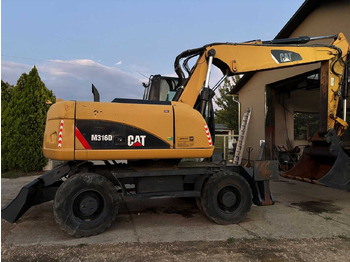 Колёсный экскаватор CATERPILLAR M316D