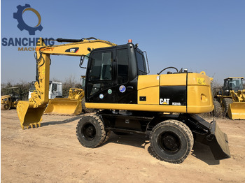 Колёсный экскаватор CATERPILLAR M320