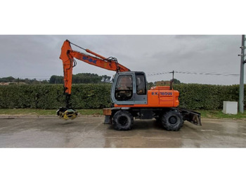 Колёсный экскаватор NEW HOLLAND