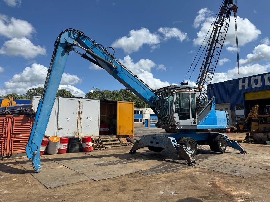 Fuchs MHL 335 - Перегружатель: фото 1 Fuchs MHL 335 - Перегружатель: фото 1