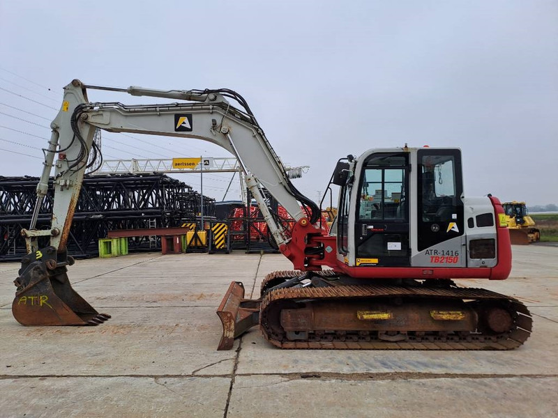 Takeuchi TB 2150 - Гусеничный экскаватор: фото 1 Takeuchi TB 2150 - Гусеничный экскаватор: фото 1
