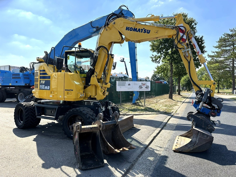 Komatsu PW 118 MR-11 14.3T - SMP ROTOTILT - *2413h* - CENTRAL GREASING - BLADE - 3 BUCKETS - TOP CONDITION - BE MACHINE - Колёсный экскаватор: фото 1 Komatsu PW 118 MR-11 14.3T - SMP ROTOTILT - *2413h* - CENTRAL GREASING - BLADE - 3 BUCKETS - TOP CONDITION - BE MACHINE - Колёсный экскаватор: фото 1