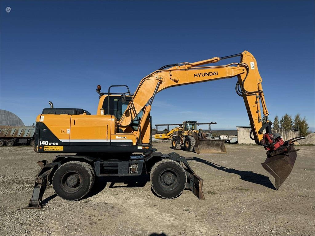 Hyundai Robex 140 W-9A Rototilt + grap - Колёсный экскаватор: фото 5 Hyundai Robex 140 W-9A Rototilt + grap - Колёсный экскаватор: фото 5