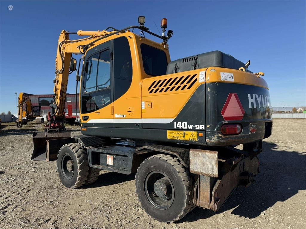 Hyundai Robex 140 W-9A Rototilt + grap - Колёсный экскаватор: фото 3 Hyundai Robex 140 W-9A Rototilt + grap - Колёсный экскаватор: фото 3