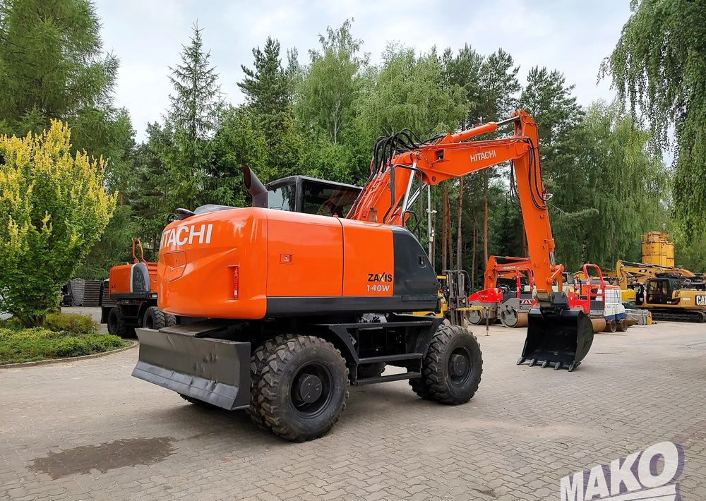 Hitachi ZX 140 - Колёсный экскаватор: фото 4 Hitachi ZX 140 - Колёсный экскаватор: фото 4