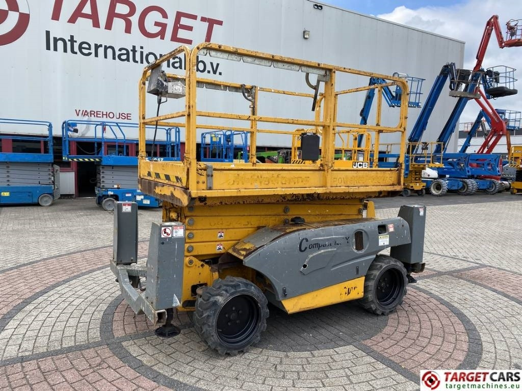 Haulotte Compact 12DX Diesel 4x4 Scissor Work Lift 1206cm - Ножничный подъемник: фото 1 Haulotte Compact 12DX Diesel 4x4 Scissor Work Lift 1206cm - Ножничный подъемник: фото 1