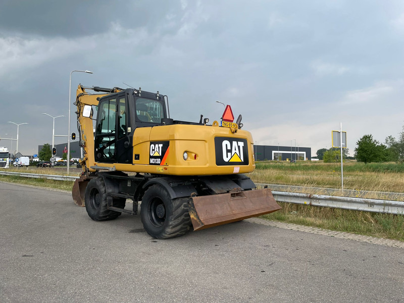 Caterpillar M313D - CE - Колёсный экскаватор: фото 1 Caterpillar M313D - CE - Колёсный экскаватор: фото 1