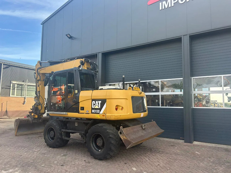 Caterpillar M313D - Колёсный экскаватор: фото 2 Caterpillar M313D - Колёсный экскаватор: фото 2