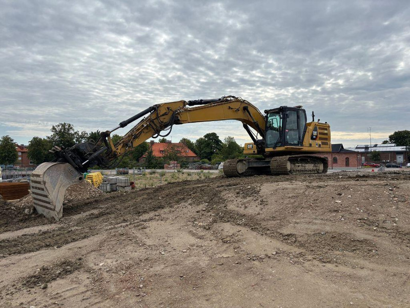 Caterpillar 323 - Гусеничный экскаватор: фото 1 Caterpillar 323 - Гусеничный экскаватор: фото 1