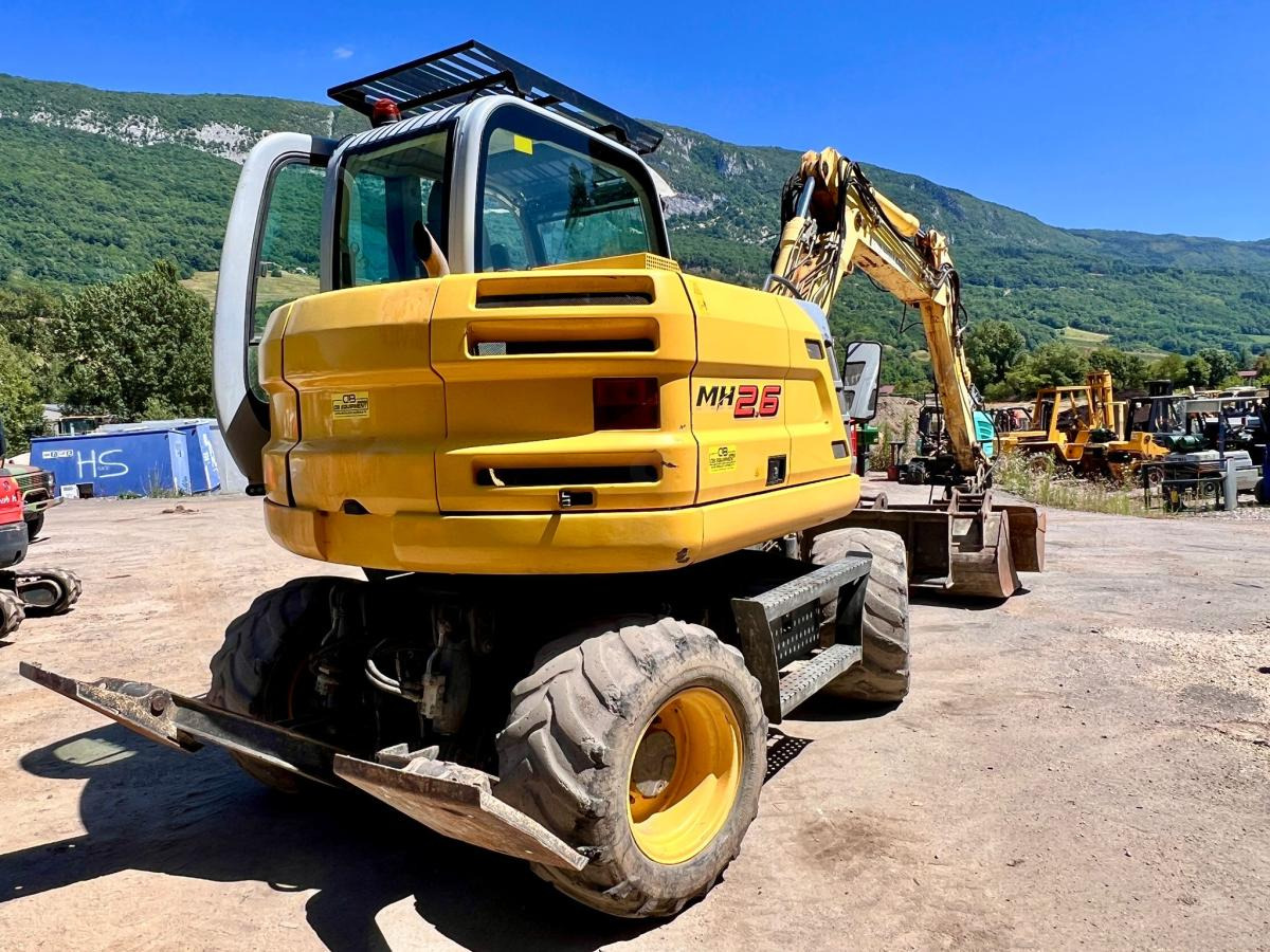 New Holland MH 2.6 PELLE A PNEUS 10T - Колёсный экскаватор: фото 4 New Holland MH 2.6 PELLE A PNEUS 10T - Колёсный экскаватор: фото 4