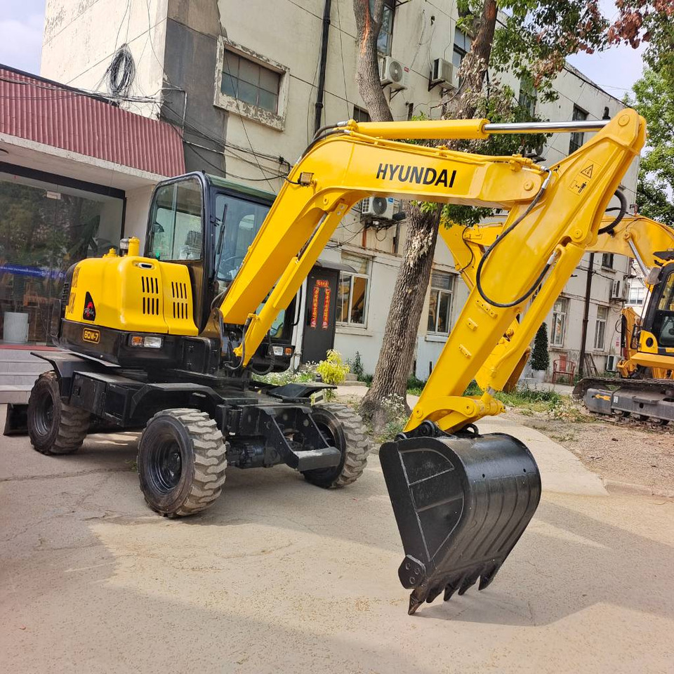Hyundai 60 W-7 60W-9 - Колёсный экскаватор: фото 1 Hyundai 60 W-7 60W-9 - Колёсный экскаватор: фото 1