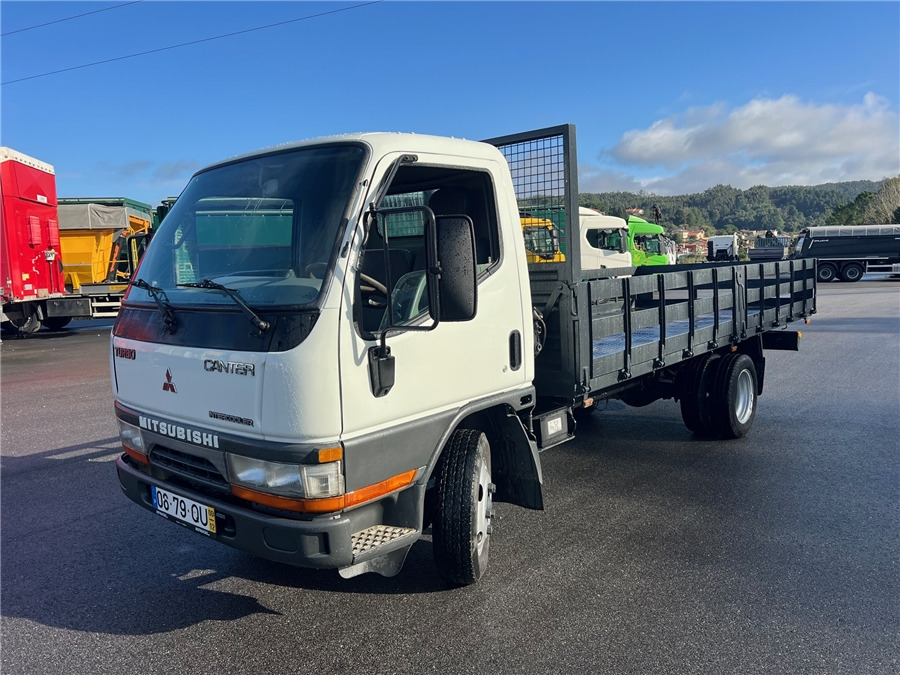 Mitsubishi - Малотоннажный бортовой грузовик: фото 1 Mitsubishi - Малотоннажный бортовой грузовик: фото 1