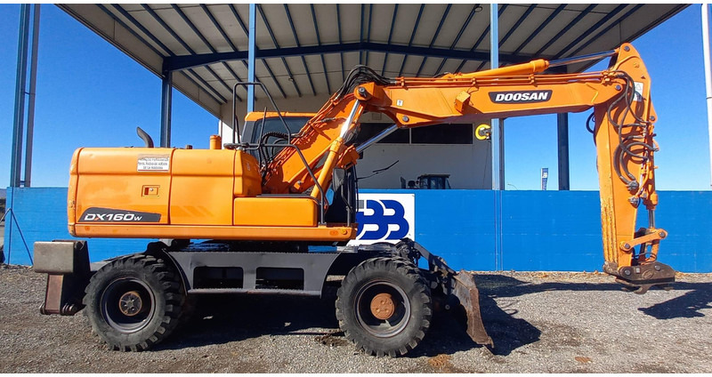 Doosan DX140W-3 - Колёсный экскаватор: фото 2 Doosan DX140W-3 - Колёсный экскаватор: фото 2