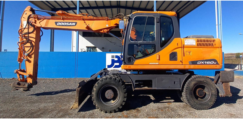 Doosan DX140W-3 - Колёсный экскаватор: фото 1 Doosan DX140W-3 - Колёсный экскаватор: фото 1