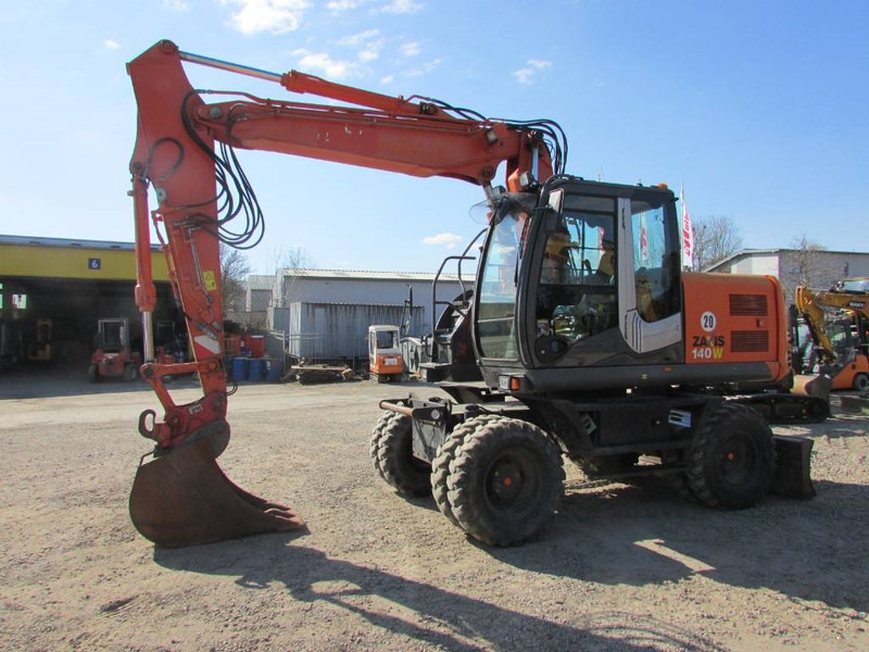 Hitachi ZX 140 W-3 Mobilbagger 43.000 EUR / Klima - Колёсный экскаватор: фото 1 Hitachi ZX 140 W-3 Mobilbagger 43.000 EUR / Klima - Колёсный экскаватор: фото 1