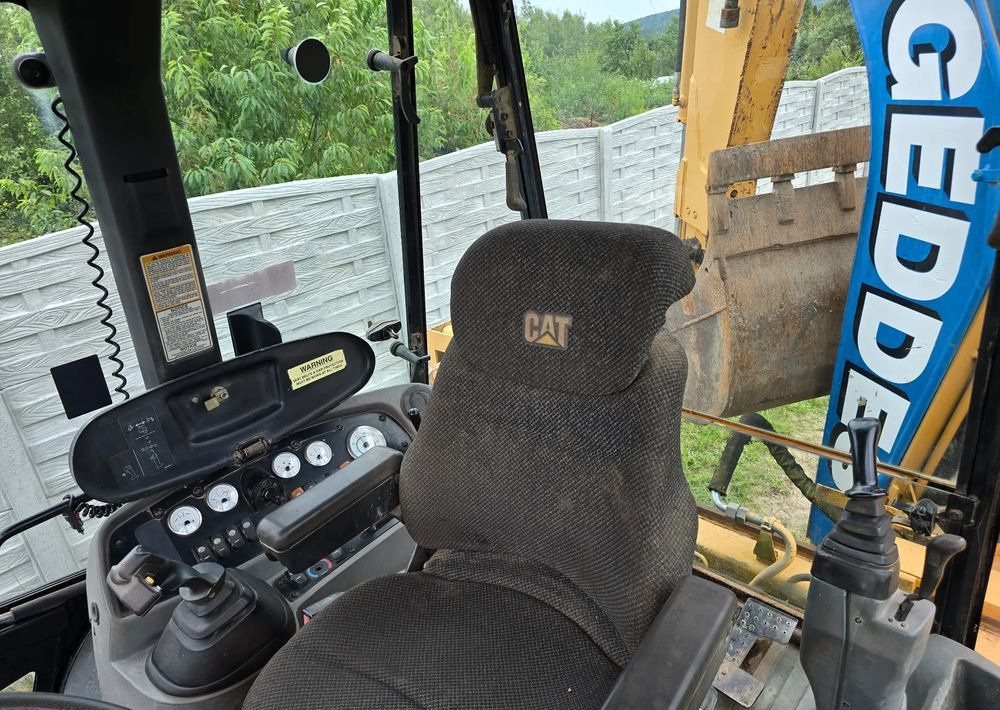 Caterpillar - Экскаватор-погрузчик: фото 2 Caterpillar - Экскаватор-погрузчик: фото 2