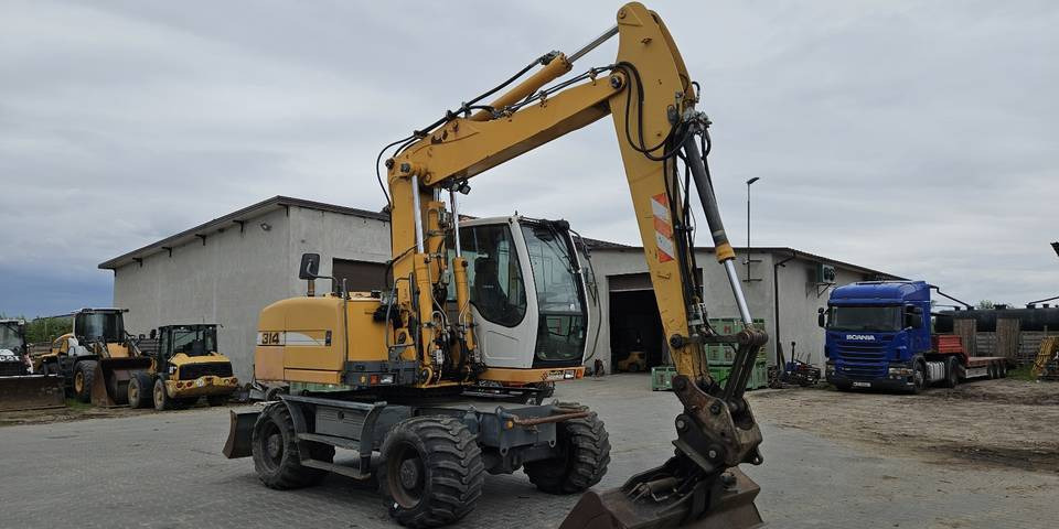 Koparka kołowa Liebherr A314 Litronic 9350 h+ 5 łyżek kołówka - Колёсный экскаватор: фото 4 Koparka kołowa Liebherr A314 Litronic 9350 h+ 5 łyżek kołówka - Колёсный экскаватор: фото 4