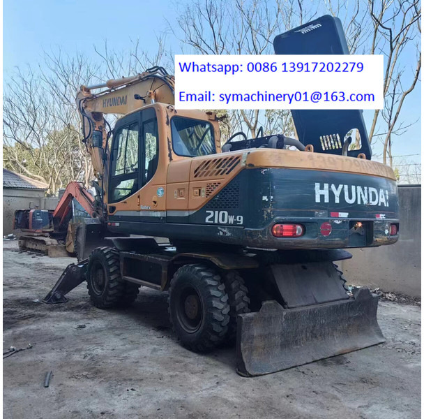 Hyundai R210W - Колёсный экскаватор: фото 1 Hyundai R210W - Колёсный экскаватор: фото 1