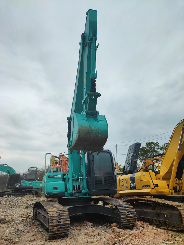 KOBELCO SK210D - Гусеничный экскаватор: фото 1 KOBELCO SK210D - Гусеничный экскаватор: фото 1