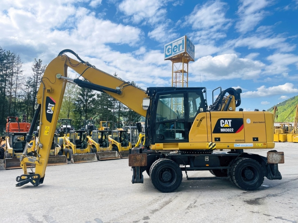 Caterpillar MH3022 (3993) - Колёсный экскаватор: фото 1 Caterpillar MH3022 (3993) - Колёсный экскаватор: фото 1