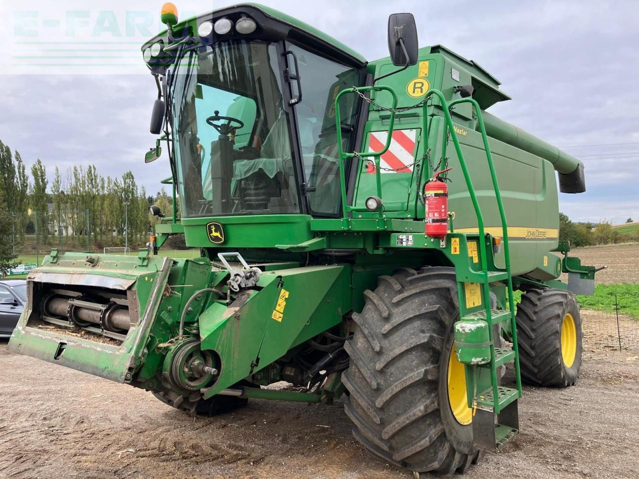 John Deere W660 HM - Зерноуборочный комбайн: фото 1 John Deere W660 HM - Зерноуборочный комбайн: фото 1