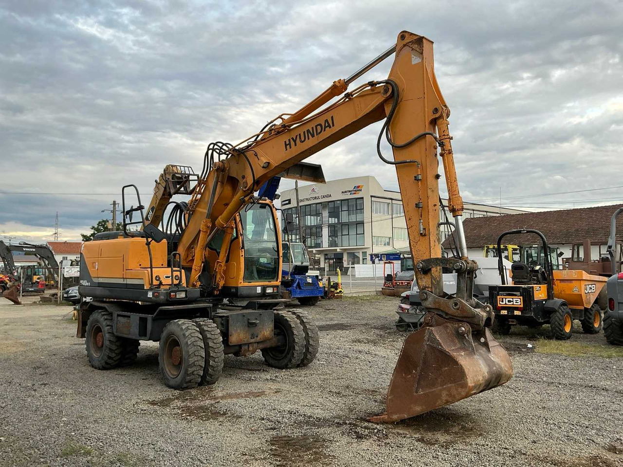 HYUNDAI ROBEX 140W-9 - Колёсный экскаватор: фото 1 HYUNDAI ROBEX 140W-9 - Колёсный экскаватор: фото 1