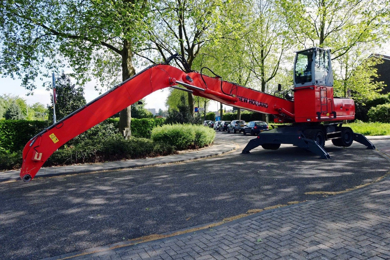 New Holland MH 6.6 Umschlagbagger - Колёсный экскаватор: фото 2 New Holland MH 6.6 Umschlagbagger - Колёсный экскаватор: фото 2