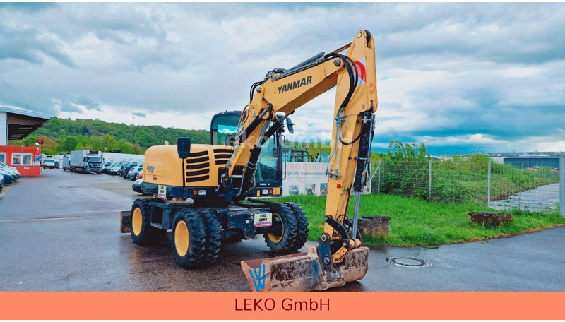 Yanmar B 95W Mit Drei Löffeln und Ein Hammer - Колёсный экскаватор: фото 1 Yanmar B 95W Mit Drei Löffeln und Ein Hammer - Колёсный экскаватор: фото 1