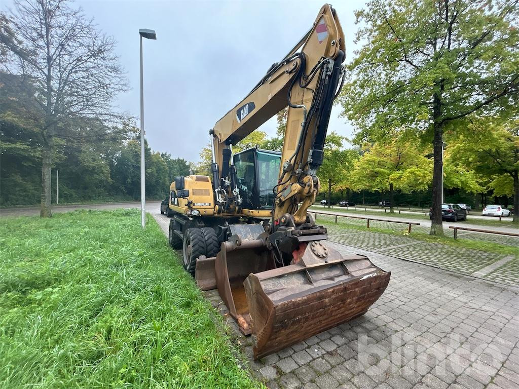 CAT M 318D - Колёсный экскаватор: фото 2 CAT M 318D - Колёсный экскаватор: фото 2